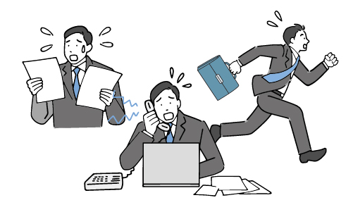 IT管理が大変で忙しい様子の社員